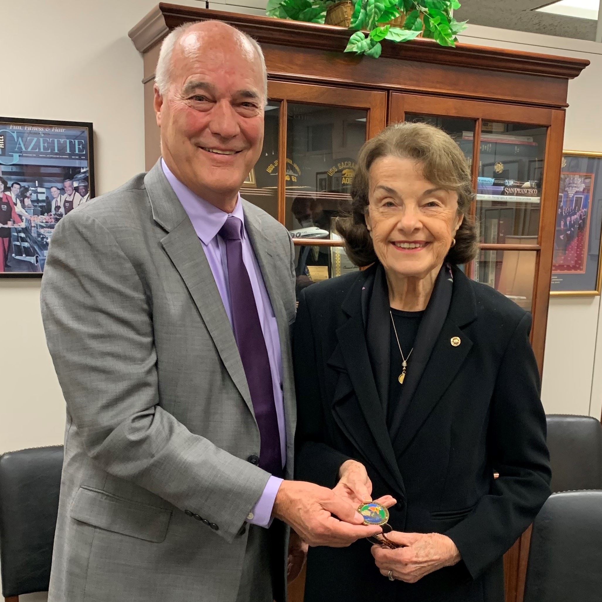Supervisor Miller presenting a Challenge Coin to Senator Feinstein_NewsFlash