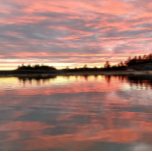 lake with sunset in background