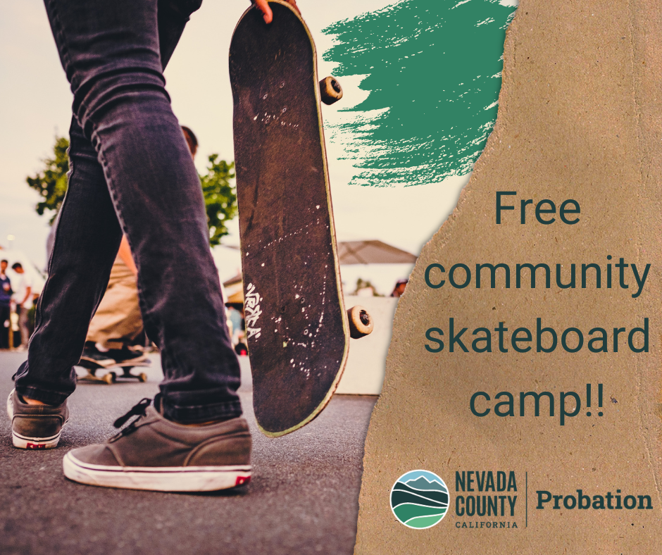 Person holding skate board and words 