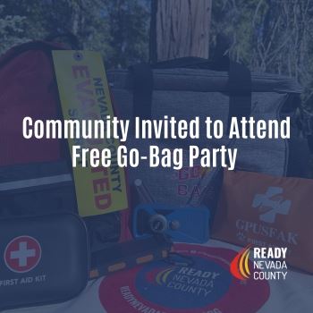 A selection of Go-Bag supplies including a tote bag and evacuation tag