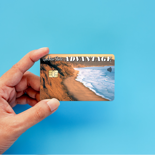 Hand holding an EBT card that says 