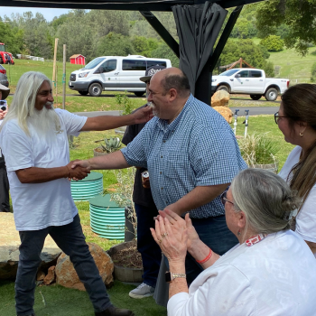Cannabis Forum Matt Kelley Cannabis and Code Compliance Director shakes hands with Juan Paniagua, ow