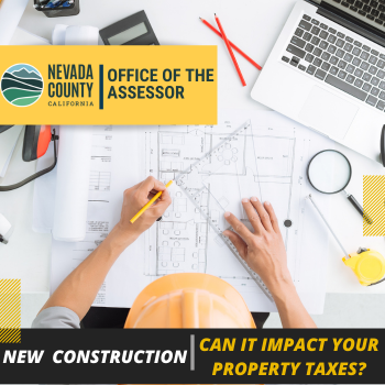 Picture of a a construction worker looking at plans.